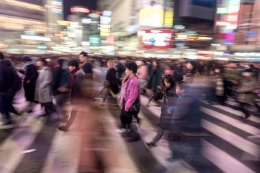 Shibuya District in Tokyo. Famous and busiest intersection in the world, Japan. Shibuya Crossing. Blurry Panning Car