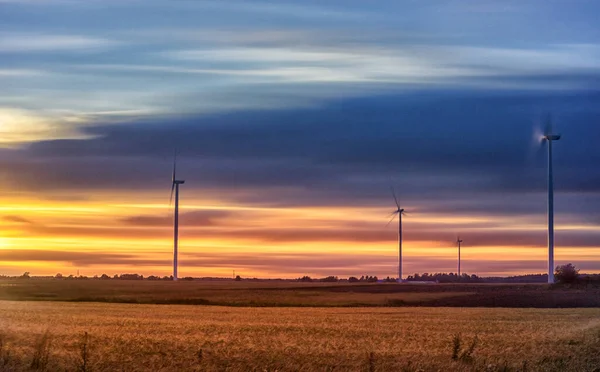 stock image Windmill in Nature. Blurry Cloudy Sky. Long Exposure. Beautiful Nature