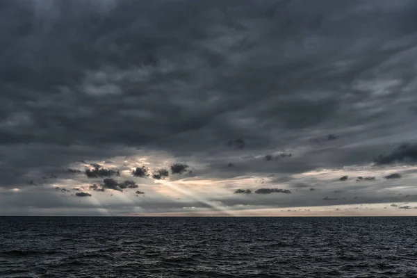 stock image Cloudy Sky over the Baltic Sea in Latvia. Europe. Beautiful Evening Sunlight ever the Water. Amazing Nature.