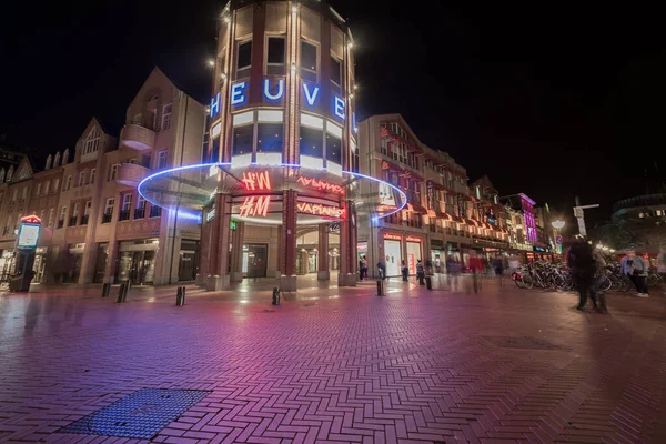 stock image EINDHOVEN, NETHERLAND - OCTOBER 17, 2017: Eindhoven Cityscape with Old Town Street. Blurry People Because of the Long Exposure. H&M And Vapiano Shops