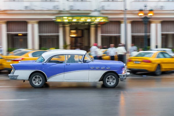 stock image HAVANA, CUBA - OCTOBER 21, 2017: Old Car in Havana, Cuba. Retro Vehicle Usually Using As A Taxi For Local People and Tourist. Panning Blue Color Car