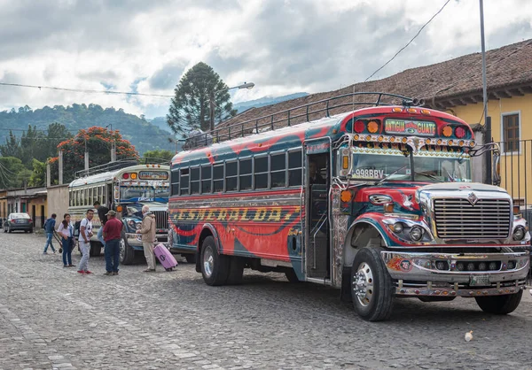 stock image ANTIAGUA, GUATEMALA - NOVEMBER 11, 2017: Antigua Bus Station, Close to Guatemala City. Famous Chicken Bus in Background. Antigua is Famous for its Spanish colonial buildings. Sighseeing Place.