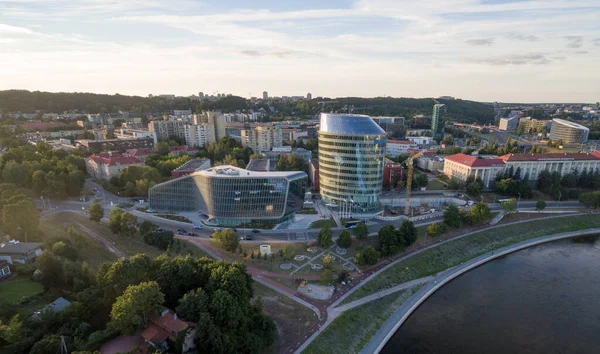 stock image VILNIUS, LITHUANIA - AUGUST 06, 2018: Lithuanian Business District with Green Hall and Barclays Building in Background