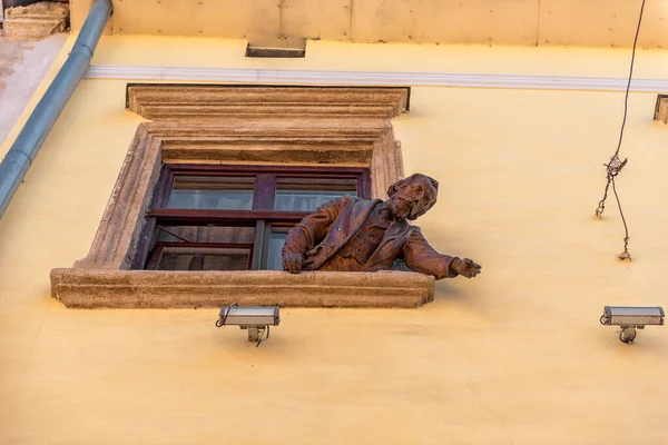 stock image LVIV, UKRAINE - SEPTEMBER 08, 2016: Lviv City and Sculpture on Window.