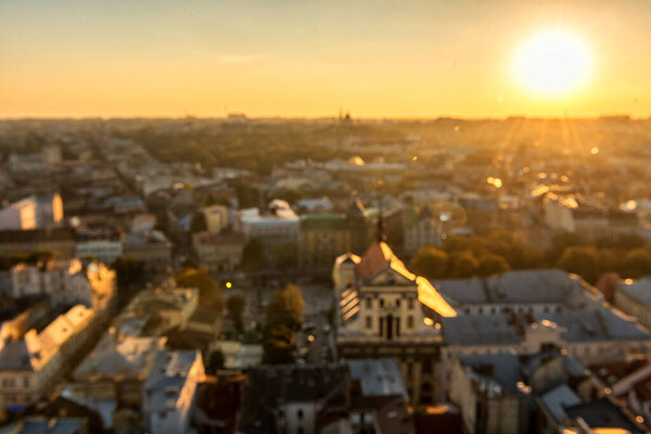 Blurry Lviv Cityscape and Sunset Light. Lviv Old Town.
