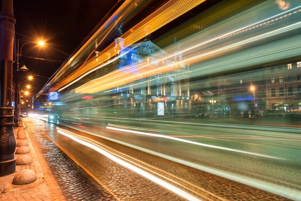 stock image Traffic Light and Lviv National Academic theatre of opera and ballet named after Solomiya Krushelnytska with People in Background. Long Exposure. Night time