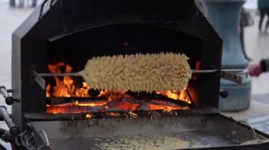 Sakotis is a Polish Lithuanian traditional spit cake. It is a cake made of butter, egg whites and yolks, flour, sugar, and cream, cooked on a rotating spit in an oven or over an open fire