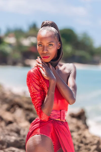 stock image Portrait of Beautiful Caribbean Adult Teen in Barbados. Wearing Red Bikini on a tropical beach. Caribbean Sea in Background. Black. Portrait.