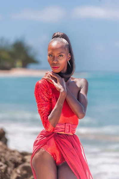 stock image Portrait of Beautiful Caribbean Adult Teen in Barbados. Wearing Red Bikini on a tropical beach. Caribbean Sea in Background. Black. Portrait.