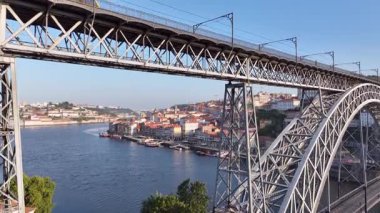 Dom Luis I Bridge and Morning Metro Train. Porto City, Portugal. Drone, 4k