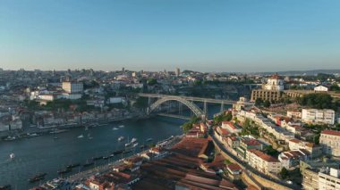 Drone Panorama of Douro river, Ribeira and Dom Luis I or Luiz I iron bridge in Porto, Portugal. 4k