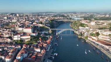 Douro river, Ribeira and Dom Luis I or Luiz I iron bridge in the sunset. Porto, Portugal. 4k