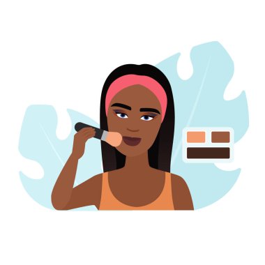 Dikdörtgen palet çiziminden kapatıcı uygulamak için fırça tutan kız