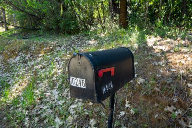 An antique mailbox in California. clipart