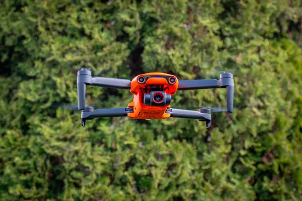Orange drone in flight, Poland.