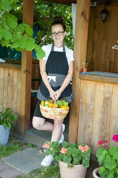 Stock image woman farmer with vegetable harvest. organic food and eco farming. greengrocer woman outdoor. harvester or gardener. summer harvesting. autumn vegetable harvest. agriculture crop. agricultural worker.