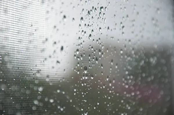 rain drop background. raindrop in autumn weather. rainy water surface on glass. wet rain drop background. droplet on window or condensation. clear reflection.
