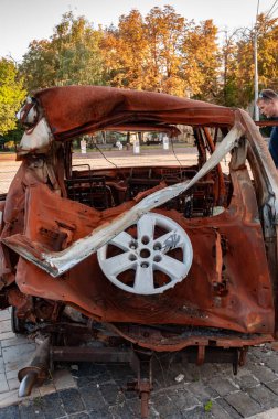 Burned car. Destroyed military equipment exhibition in Kyiv, Ukraine for Ukrainian Independence day 2024. Destroyed Russian equipment on Mykhailivska Square in Kyiv. clipart