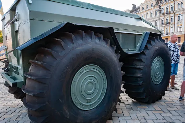 stock image Kyiv, Ukraine - August 25, 2024: Sherp all-terrain vehicle. Cross-country vehicle. Military utility vehicle Sherp. Military vehicle with huge wheels, side view.