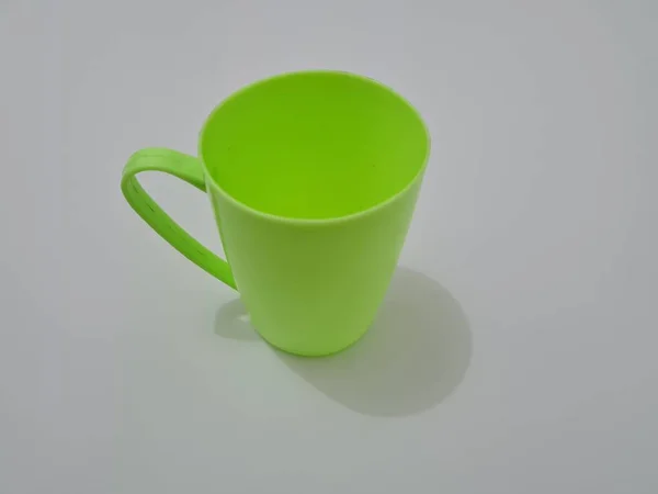 Ein Glas Aus Kunststoff Mit Grünem Griff — Stockfoto