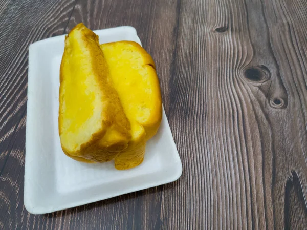 stock image Yellow brown comb bread with sweet butter spread is suitable for eating at any time