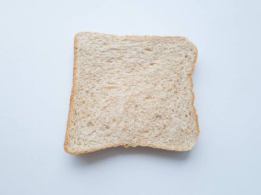 Bir dilim sade buğday ekmeği, ya hemen yenir ya da üstüne çikolata ya da başka bir şey.