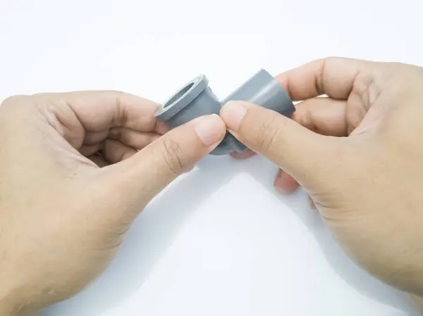 Stock image Water pipe turning connection in gray on white background