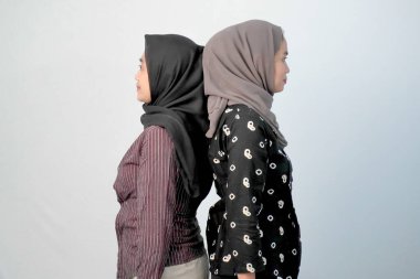 Two Indonesian women wearing hijabs wearing regional clothes from Java clipart