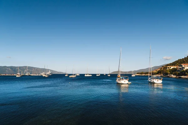 stock image White yachts anchored in blue bay of Agia Efimia port, Cephalonia island, Greece