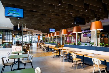 Sibiu, Romania - May, 2 2022: Food court area in Promenada Mall, one of the biggest shopping centers in Sibiu