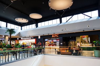 Sibiu, Romania - May, 2 2022: KFC, Kentucky Fried Chicken, American fast food restaurant in food court area in Promenada Mall, one of the biggest shopping centers in Sibiu