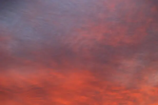 A stunning pink, orange and violet clouds at sunrise sky. Sunset sky background