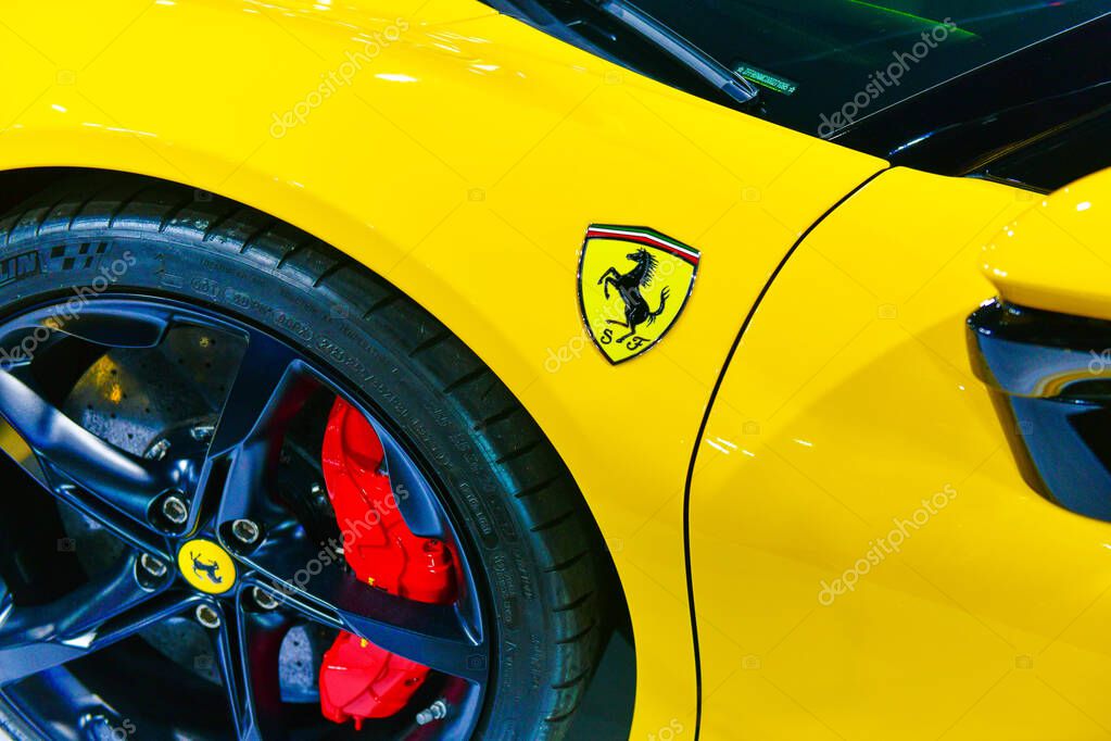Thailand-March 27,2024: Logo of ferrari on the yellow super car. is an Italian luxury sports car manufacturer. Founded by Enzo Ferrari at the 45 Bangkok International Motor Show in Nonthaburi
