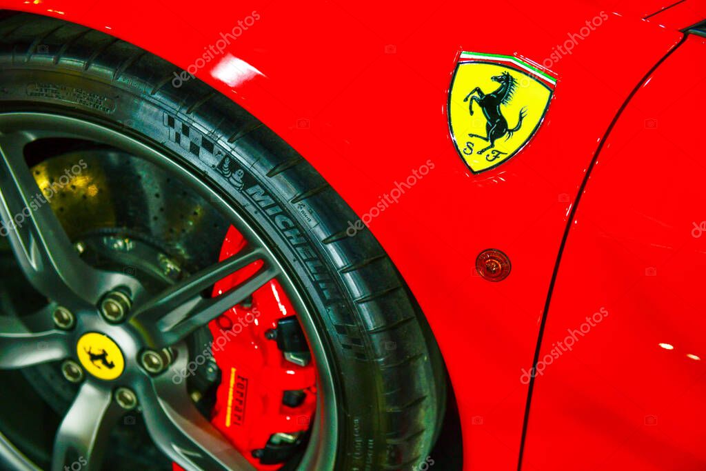 Thailand-March 27,2024: Logo of ferrari on the red super car. is an Italian luxury sports car manufacturer. Founded by Enzo Ferrari at the 45 Bangkok International Motor Show in Nonthaburi