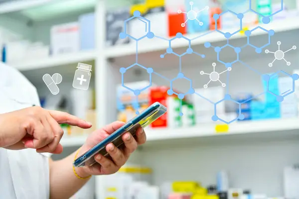 Pharmacist using mobile smart phone for search bar on display in pharmacy drugstore shelves background.Online medical concept.