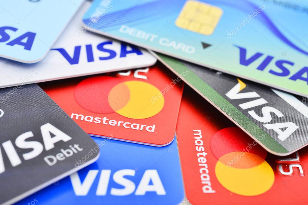 Bangkok, Thailand - August 3, 2017: Close up of many VISA and MASTER credit card background with new logo.plastic bank payment cards