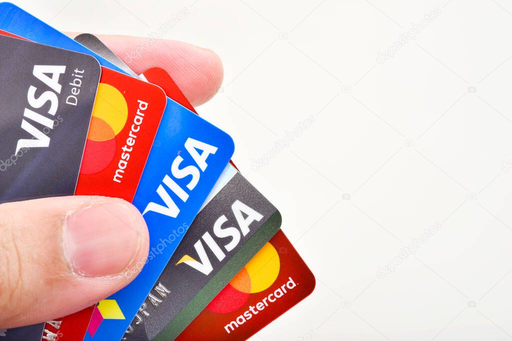 Bangkok, Thailand - August 3, 2017: Close up of many VISA and MASTER credit card background with new logo.plastic bank payment cards