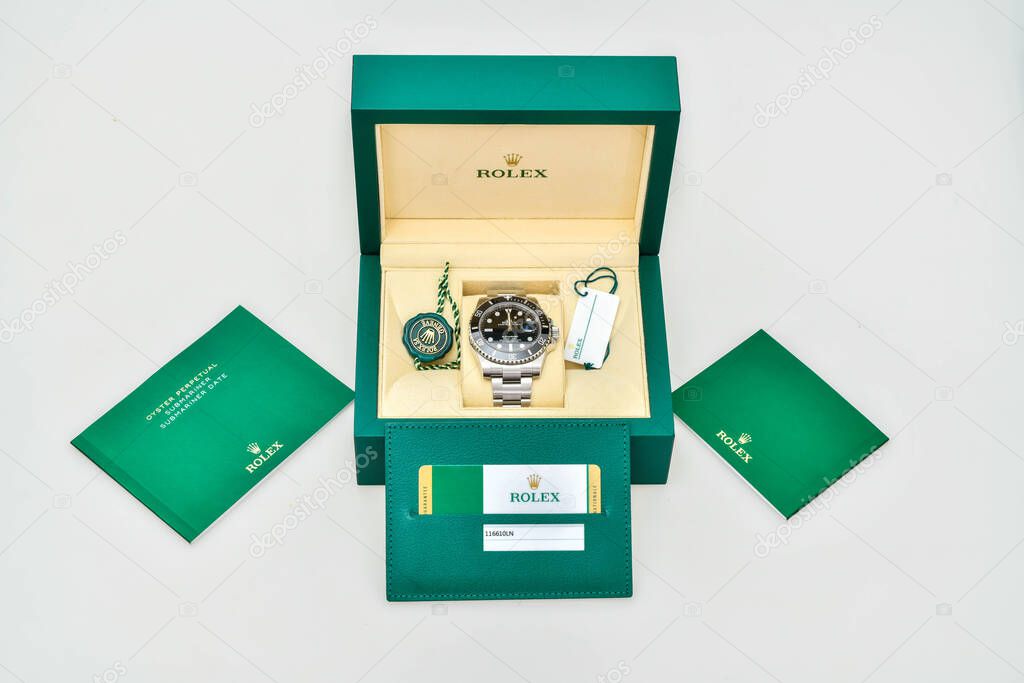 Bangkok Thailand- January 28,2021: Rolex Submariner Date Steel Black on Rolex green box crown logo , coin manual book