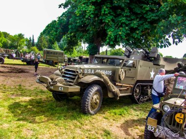 SAINTE MERE L'EGLISE, FRANCE - JUNE 6, 2019. Celebration of the D-DAY, armed landing, end of world war two in Normandy, with help of allied countries soldiers. Half track miltary army vehicle