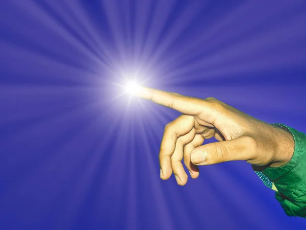 Close up of a young indian man hand pointing finger as touching screen with light ray, isolated on blue background. Innovation technology internet business concept background for graphic designer