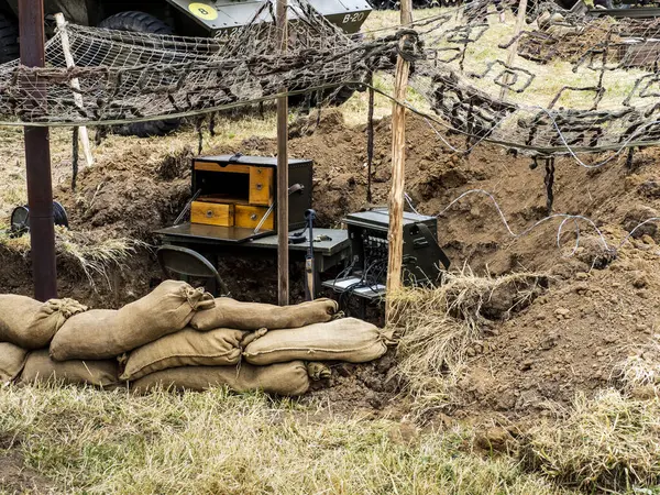stock image SAINTE MERE L'EGLISE, NORMANDY, FRANCE - JUNE 6 2023. Second world war commemoration. Military camp reconstitution Trench with machine gun and sandbags protection.