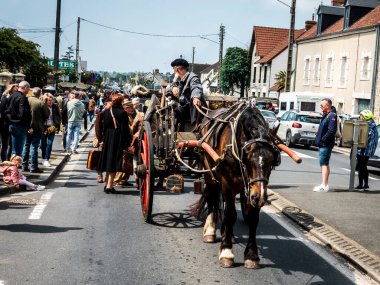 SAINTE MERE L'EGLISE, NORMANDY, FRANCE - JUNE 6 2023. Second world war commemoration. Unidentified vintage dressed rural families exodus due to war. Reconstitution for birthday liberation. clipart