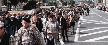 SAINTE MERE L'EGLISE, NORMANDY, FRANCE - JUNE 6 2023. Second world war commemoration. Unidentified vintage dressed rural families exodus due to war. Reconstitution for birthday liberation. clipart
