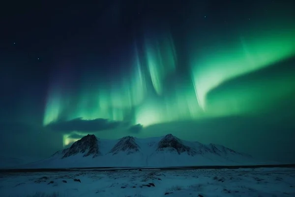 stock image aurora borealis shining in the sky over a snowy landscape in iceland. High quality photo