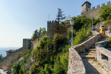 Ancient walls and stairs in fortification castle in old town of San Marino clipart