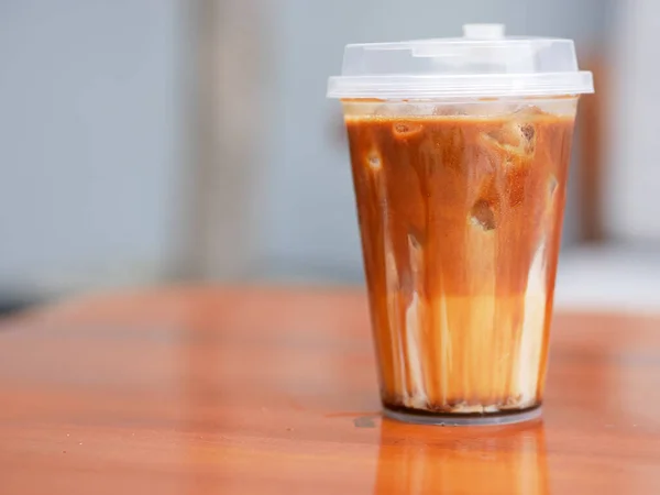 fresh brown sugar coffee drink in a transparent plastic cup