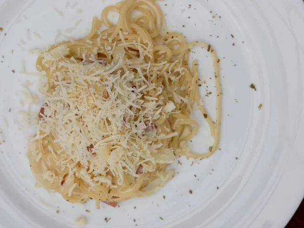 stock image spaghetti with cheese and pepper on a white plate