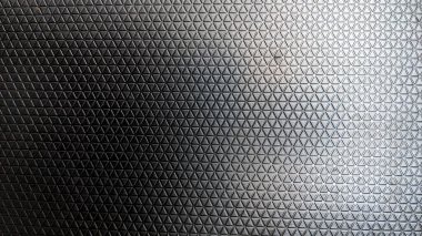 black plastic triangle texture for background