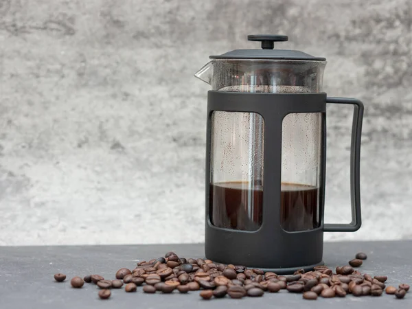 french press coffee maker pot and coffee beans