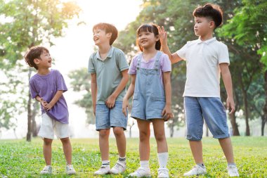 group image of cute asian children playing in the park